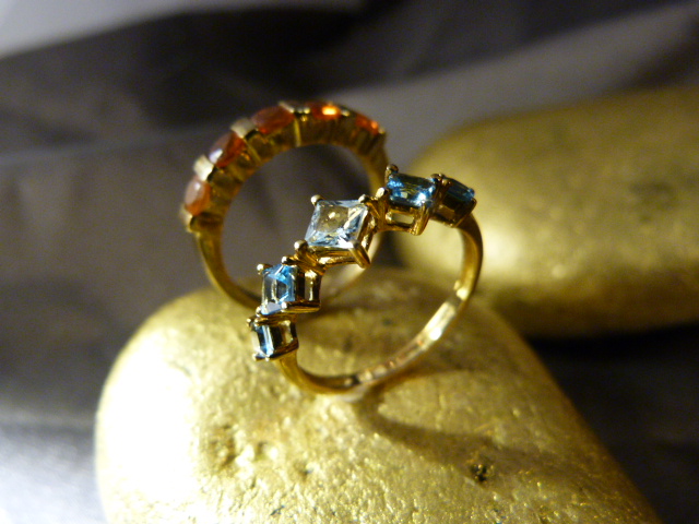2 9ct Gold Gem stone set rings by QVC. (1) 5 pale blue Princess Cut stones set in a band. (2) 5