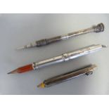 Three propelling pencils. One silver hallmarked Sampson Morden & Co 1927, the other a Victorian