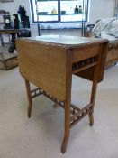 Small golden oak sofa table with 'galleried' style design to the supports on tapered legs