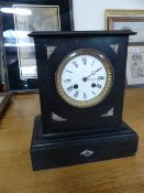 Slate mantle clock with inlaid with marble. White Roman Number dial is enamelled and surrounded by