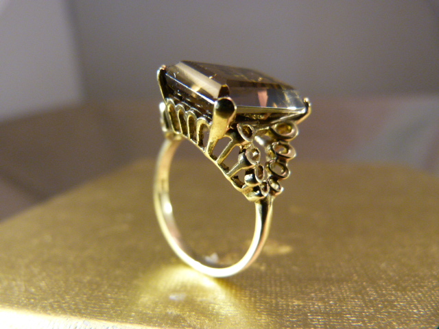 9ct Gold ring by SJ, contemporary design from 1977. Set with an approx 5carat Emerald Smokey