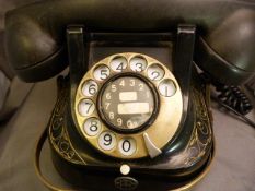 A Black painted and Gilt brass mounted telephone, marked 'Belgique Bell Telephone M.F.G company'