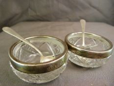 Pair of cut glass salts with hallmarked silver rims ( Birmingham 1911 by T H Hazlewood and Co.)