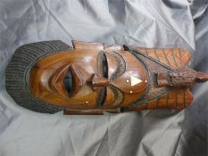 African Tribal mask inlaid with ivory decoration and eagle motif to top