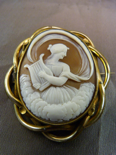 Large Victorian Pinchbeck, very fine brown Cameo Brooch depicting Erato playing her Lyre. Erato is