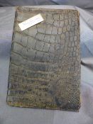 A Vintage Crocodile leather purse with all fittings inside - to front is a small engraved silvered