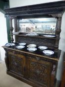 Heavily Carved Oak Gothic revival dresser with carved Greenman head handles to drawer and below a