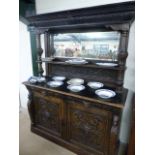 Heavily Carved Oak Gothic revival dresser with carved Greenman head handles to drawer and below a