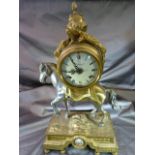 An 'Imperial' Italian Mantel Clock, surmounted on horse and brass mossy base with bun feet. (key