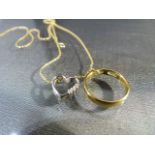 9ct Gold chain with hanging double pendant. The circular pendant has a hanging heart set with