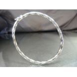 9ct White gold Twisted hollow tube Bangle. Approx 3.85mm wide. Weight approx 4.1g