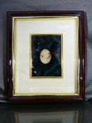 Signes Amalfi Cameo in frame, the female head sits in Green Velvet and faces to the right, she has