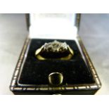 Vintage 18ct P&L 3 stone diamond ring. Centre stone approx 0.10pts with a 0.05pt diamond either