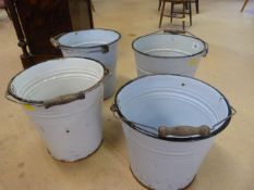 Four white enamelled buckets