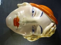 A 1930s Beswick Art Deco style female wall mask, impressed marks verso, number 197 Beswick Ware.