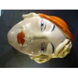 A 1930s Beswick Art Deco style female wall mask, impressed marks verso, number 197 Beswick Ware.