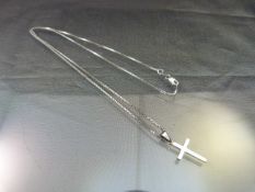 Platinum cross pendant approx 12mm across x 26.25mm deep including the bale. Hung from an approx 22"