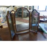 Mahogany veneered bevelled mirror on bun feet