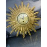 Sunburst 20th century Gilt wood wall clock, brass Japy Freres keywind movement, key in office
