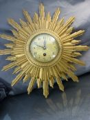 Sunburst 20th century Gilt wood wall clock, brass Japy Freres keywind movement, key in office