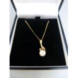 Boxed 14K yellow gold 6.7mm cultured pearl pendant and a 14K chain (20" long) Gross weight 2.7g