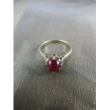 9ct White gold and star ruby ring. Star Ruby set in high claw setting. Weight approx 2.7g UK