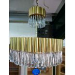 Large retro solid brass chandelier with extensive glass droplets and matching wall lights.