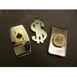 A Stainless steel money clip by Baraka with 18ct Gold hallmarked panel in the Form of a Jack Card.