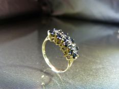 9ct Gold Dress ring of 4 Interlocking sapphire and Diamond Clusters with 4 approx 0.02pt Diamonds