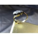 Vintage 9ct Gold 3 stone Diamond (illusion set) Crossover ring. Centre Stone approx 0.05pts with
