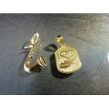 18ct Yellow Gold. - To include two pendants both hallmarked - 1 of a saxophone and one saying 'I