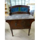 Stained pine washstand with marble top and blue tiled back