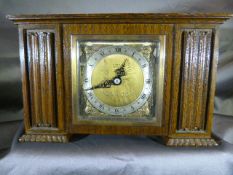 An Art Deco Elliot oak cased clock retailed by Flinn & Co Coventry