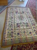 Turkish handwoven cloth on a Beige metallic ground. Tassled ends. Decorated with a floral border and