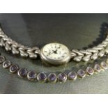 Hallmarked silver Amethyst set bracelet along with a Hallmarked silver dress watch by Royal. Total