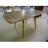 Blonde Ercol drop leaf dining table
