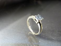 18ct White Gold 'square solitaire' style ring, made up of 4 small 'Princess Cut' Diamonds. The