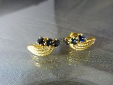 Pair of Sapphire and Diamond Earrings, in unmarked Gold (possibly High Carat). A Line of 3 Oval