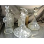 A collection of six various decanters one with thistle shaped stopper