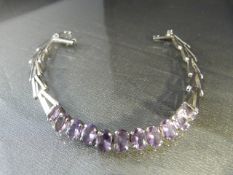 Silver (925) Amethyst Bracelet approx 7.5mm wide x 8" long, set with 11 pale Oval Amethysts