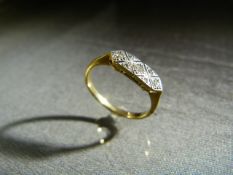 18ct Yellow gold Art Deco Ring with seven small diamonds chips in a Lozenge shape setting. Shank has