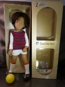 A Sasha Gregor doll, vinyl head and body, airbrushed detail to face, brown wig, dressed as a