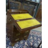 Modern brass bound campaign style chest of four drawers with writing slope to top