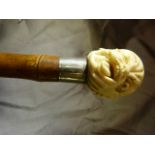 Ivory 'Grotesque Head' walking cane with hallmarked silver collar 1902