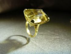 9ct Gold Hallmarked Smokey Quartz large stone ring. High set stone with scroll decoration below.