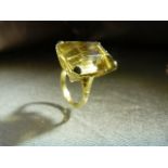 9ct Gold Hallmarked Smokey Quartz large stone ring. High set stone with scroll decoration below.