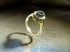 Sapphire and CZ set Gold on silver dress ring. Weight 3.6g approx