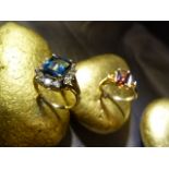 Two 9ct Gold gem stone cluster rings by QVC. (1) Central Sherry coloured emerald cut stone, with a