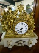 French style mantle clock with enamel face on Alabaster plinth. Spelter decorated face with two