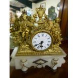 French style mantle clock with enamel face on Alabaster plinth. Spelter decorated face with two